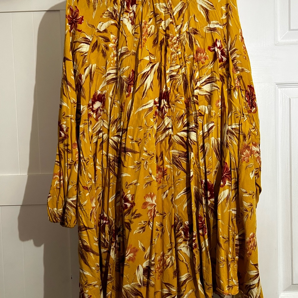Yellow printed swing dress with long sleeves and high neck